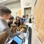 Course instructor teaching 3D printing at stem summer camp